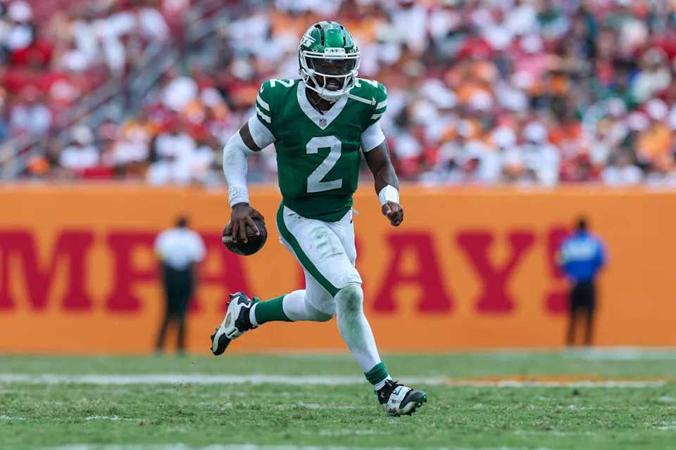 Sep 21, 2025; Tampa, Florida, USA; New York Jets quarterback Tyrod Taylor (2) runs with the ball against the Tampa Bay Buccaneers in the fourth quarter at Raymond James Stadium. Mandatory Credit: Nathan Ray Seebeck-Imagn Images