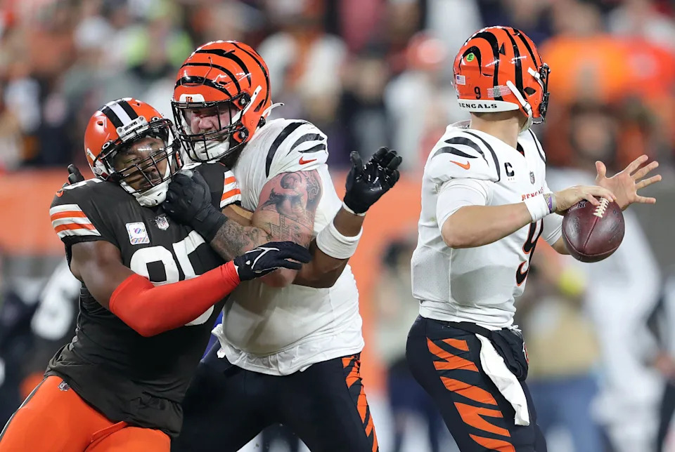 Cincinnati Bengals quarterback Joe Burrow (9) passes under pressure from Cleveland Browns defensive end Myles Garrett (95) on Oct. 31, 2022, in Cleveland.