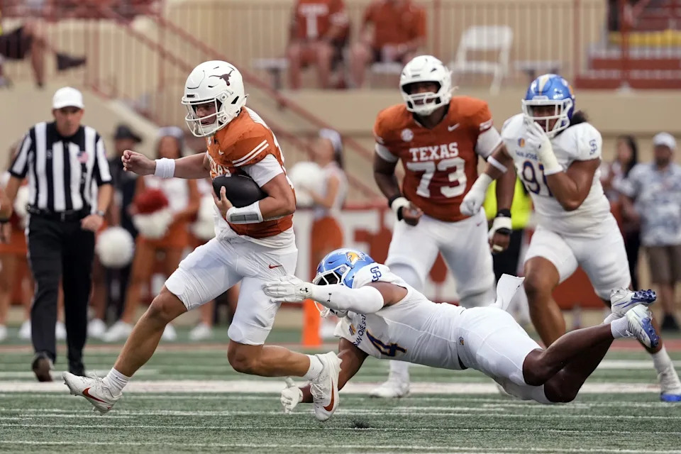 Texas quarterback Arch Manning (16) is tackled by San Jose State after keeping the ball for yardage during the first half at Darrell K Royal-Texas Memorial Stadium.