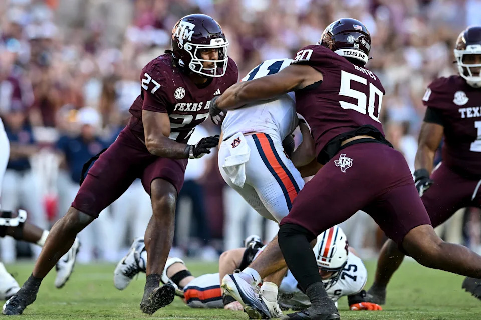 Sep 27, 2025; College Station, Texas, USA; Texas A&M Aggies defensive end Dayon Hayes (50) sacks Auburn Tigers quarterback Jackson Arnold (11) during the second half at Kyle Field.
