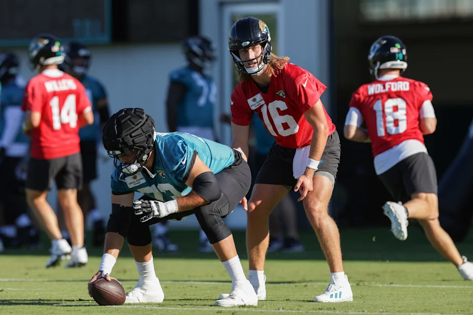 Jul 24, 2025; Jacksonville, FL, USA; Jacksonville Jaguars quarterback Trevor Lawrence (16) and center Robert Hainsey (73) participate in training camp at Miller Electric Center. Mandatory Credit: Nathan Ray Seebeck-Imagn Images