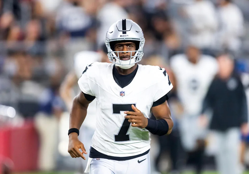Aug 23, 2025; Glendale, Arizona, USA; Las Vegas Raiders quarterback Geno Smith (7) against the Arizona Cardinals during a preseason NFL game at State Farm Stadium. Mandatory Credit: Mark J. Rebilas-Imagn Images