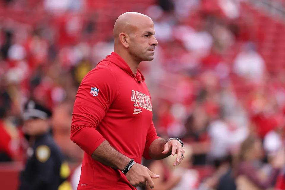 San Francisco 49ers defensive coordinator Robert Saleh watches players warm up before an NFL football game against the Jacksonville Jaguars in Santa Clara, Calif., Sunday, Sept. 28, 2025. (AP Photo/Kelley L. Cox)