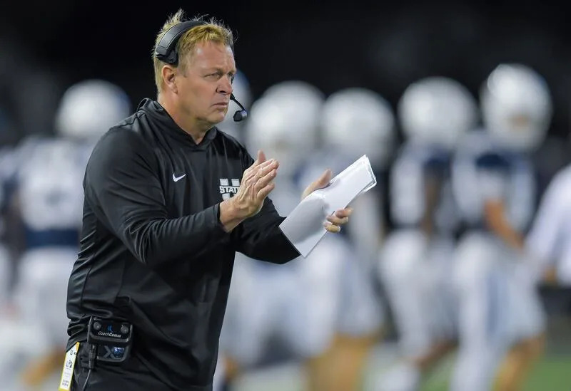 Utah State head coach Bronco Mendenhall claps after the Aggies scored a touchdown against Air Force in the second half Saturday Sept. 13, 2025, in Logan, Utah. | Eli Lucero/Herald Journal