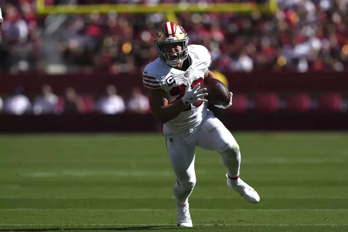 San Francisco 49ers running back Christian McCaffrey runs the ball during the second half of an NFL football game Sunday, Sept. 21, 2025, in Santa Clara, Calif. (AP Photo/Godofredo A. Vásquez)