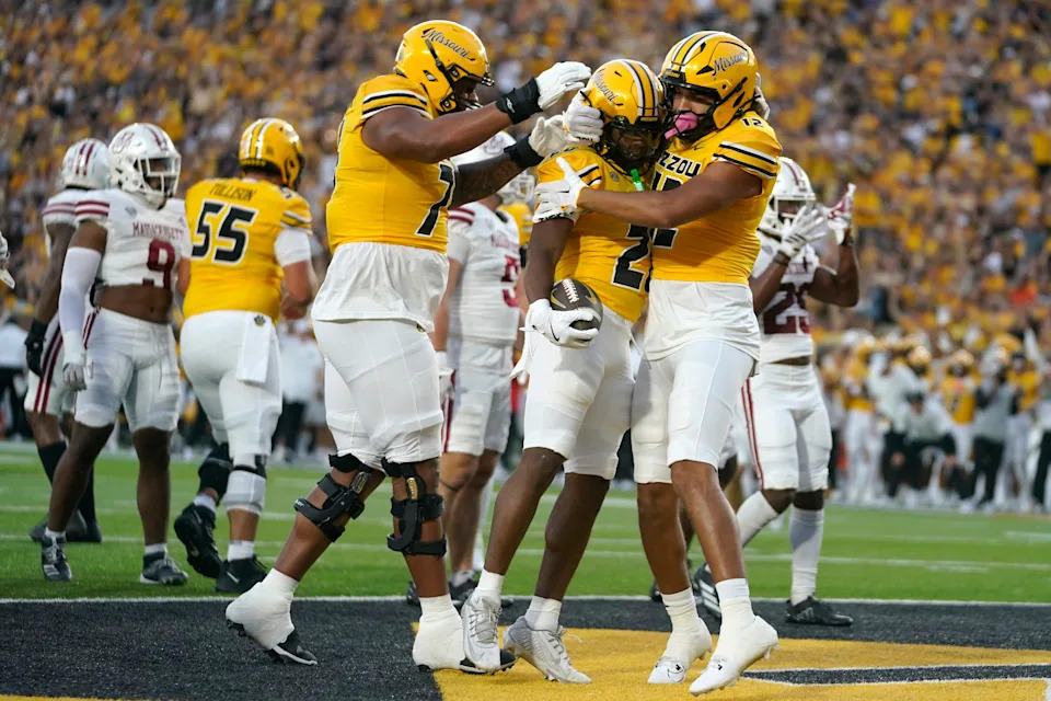COLUMBIA, MISSOURI - SEPTEMBER 27: Running back Jamal Roberts #20 of the Missouri Tigers celebrates his touchdown with tight end Vince Brown II #12 and offensive lineman Jayven Richardson #75 against the Massachusetts Minutemen in the first half at Faurot Field at Memorial Stadium on September 27, 2025 in Columbia, Missouri. (Photo by Ed Zurga/Getty Images)