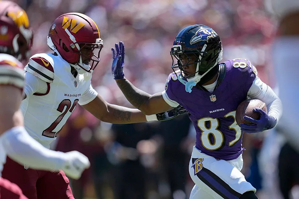 LaJohntay Wester of the Baltimore Ravens runs with the ball as Car'lin Vigers of the Washington Commanders defends during the first half of the NFL Preseason 2025 game at Northwest Stadium on August 23, 2025 in Landover, Maryland.