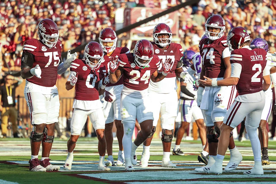 Sep 13, 2025; Starkville, Mississippi, USA; Mississippi State Bulldogs running back Fluff Bothwell (24) celebrates with teammates after a touchdown during the first quarter against the Alcorn State Braves at Davis Wade Stadium at Scott Field. Mandatory Credit: Wesley Hale-Imagn Images