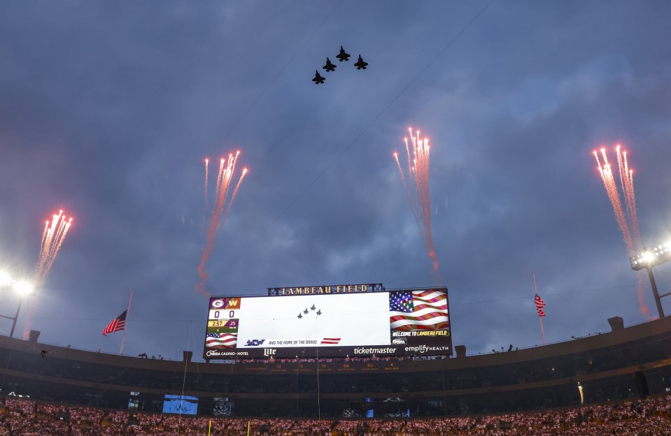 Fighter jets flyover during the National Anthem at Lambeau Field.
