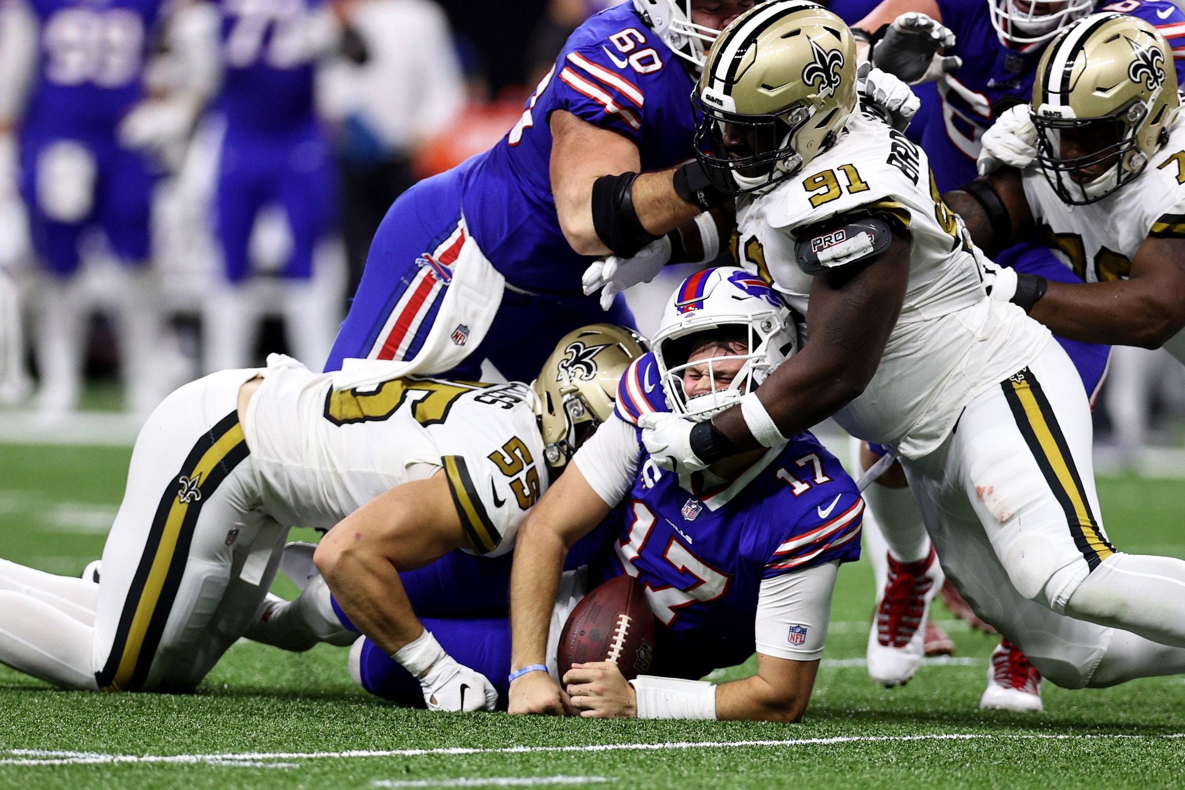NEW ORLEANS, LOUISIANA - NOVEMBER 25: Josh Allen #17 of the Buffalo Bills is sacked by Kaden Elliss #55 of the New Orleans Saints during the second quarter at Caesars Superdome on November 25, 2021 in New Orleans, Louisiana. (Photo by Chris Graythen/Getty Images)