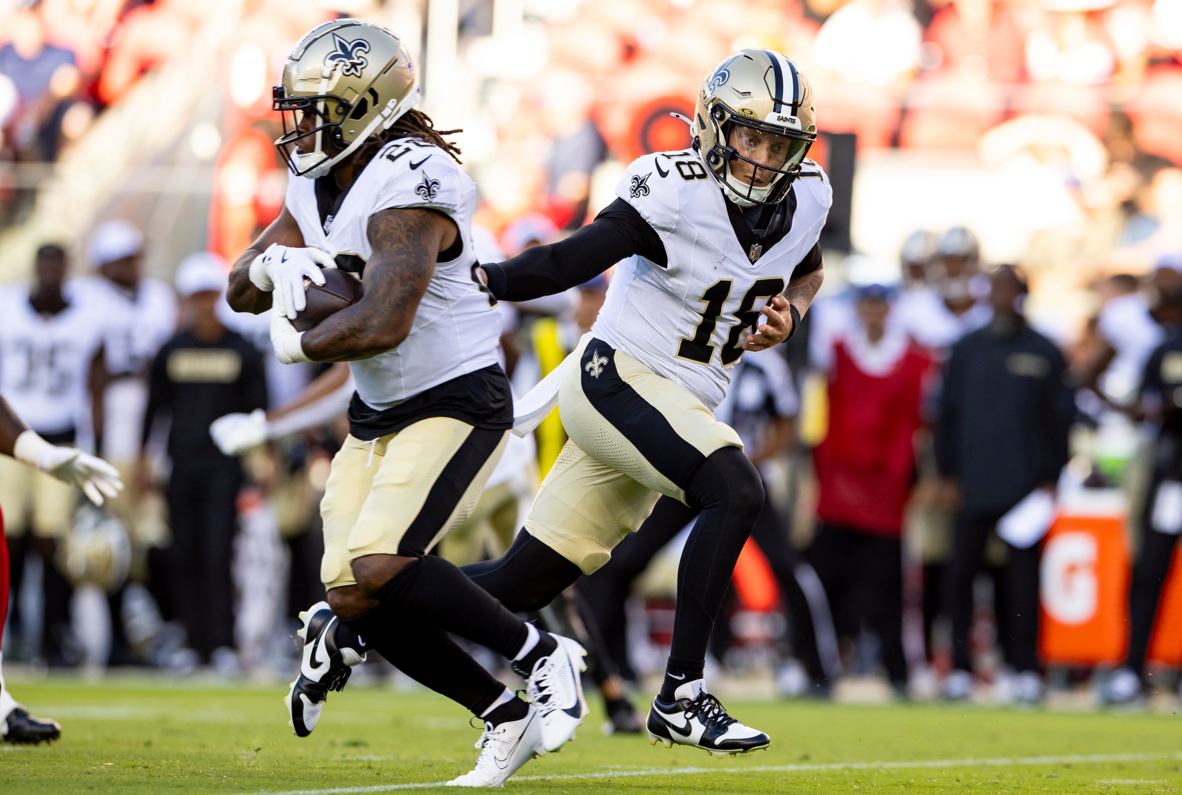 SANTA CLARA, CA - AUGUST 18: Quarterback Spencer Rattler #18 of the New Orleans Saints hands off the bal during the second quarter of an NFL preseason football game against the San Francisco 49ers, at Levi’s Stadium on August 18, 2024 in Santa Clara, California. (Photo by Brooke Sutton/Getty Images)