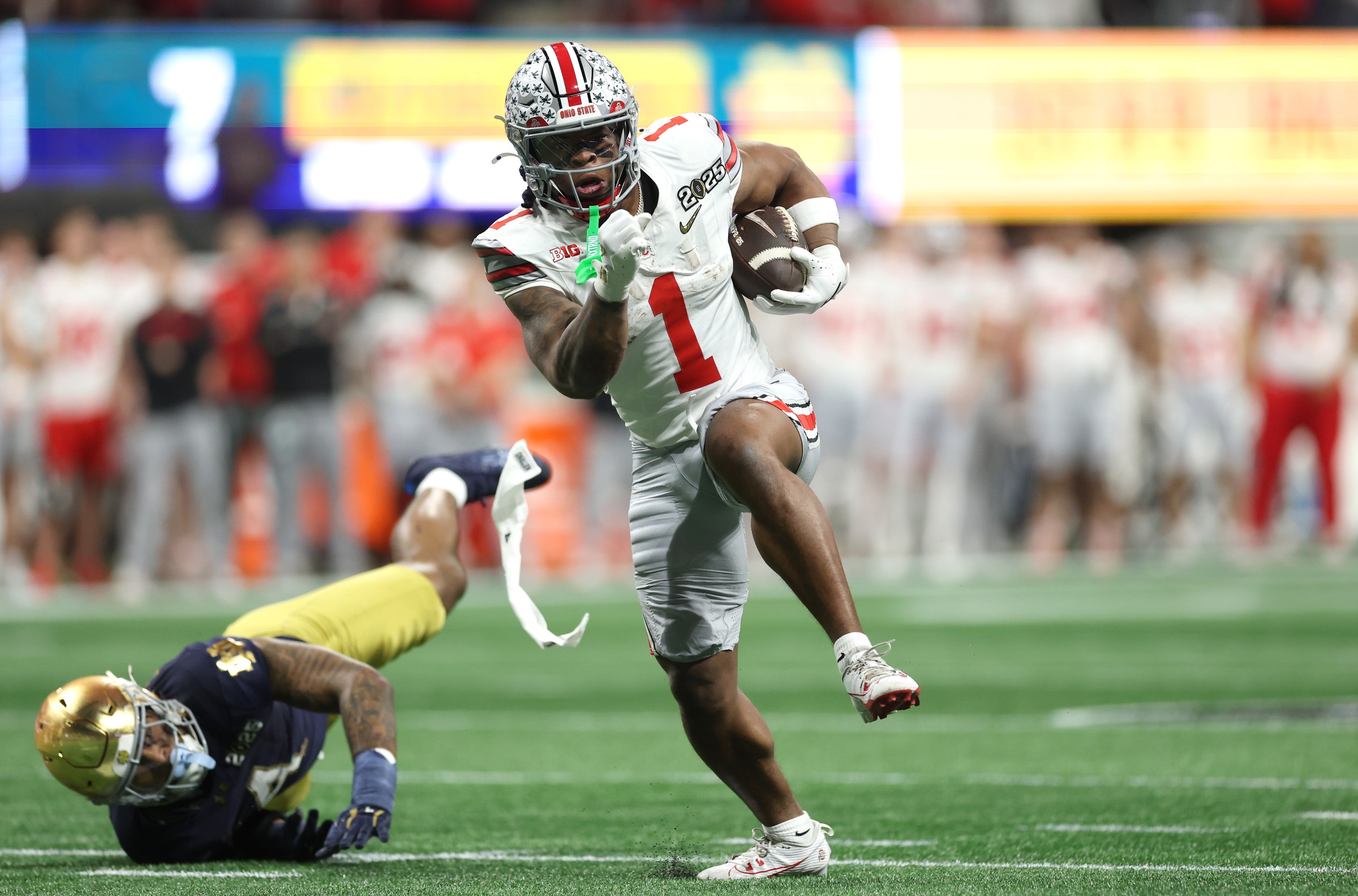 ATLANTA, GEORGIA - JANUARY 20: Quinshon Judkins #1 of the Ohio State Buckeyes runs for a touchdown against the Notre Dame Fighting Irish during the second quarter in the 2025 CFP National Championship at the Mercedes-Benz Stadium on January 20, 2025 in Atlanta, Georgia. (Photo by Jamie Squire/Getty Images)