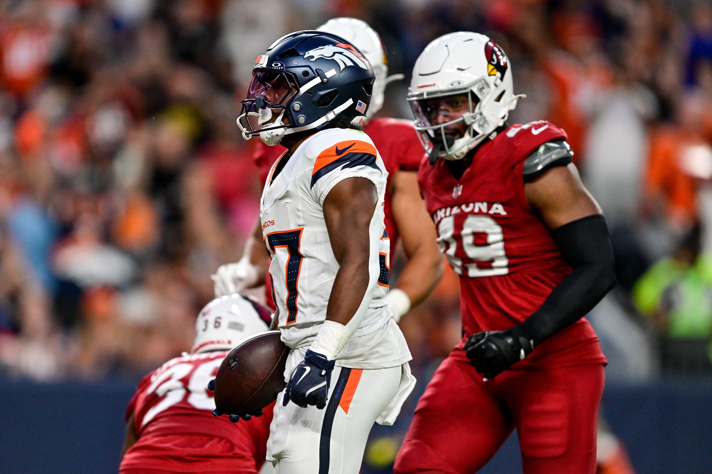 DENVER, CO - AUGUST 16: Denver Broncos running back RJ Harvey (37) celebrates after his first quarter touchdown during a preseason game between the Arizona Cardinals and the Denver Broncos at Empower Field at Mile High on August 16, 2025 in Denver, Colorado. (Photo by Dustin Bradford/Icon Sportswire via Getty Images)