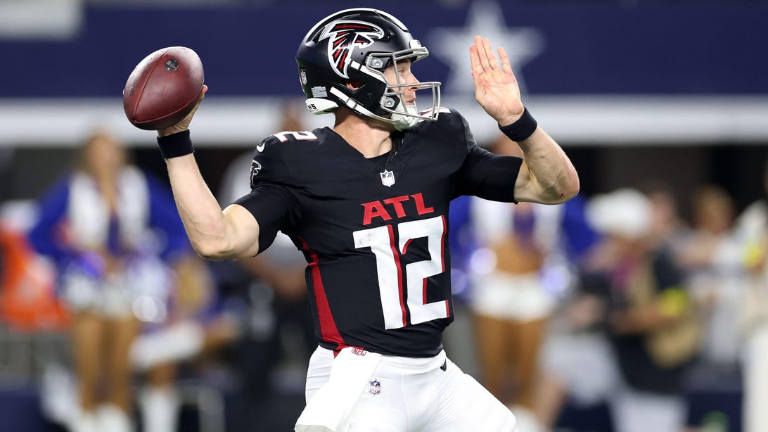 ARLINGTON, TEXAS - AUGUST 22: Easton Stick #12 of the Atlanta Falcons drops back to pass during the second half of an NFL Preseason 2025 game against the Dallas Cowboys at AT&T Stadium on August 22, 2025 in Arlington, Texas.