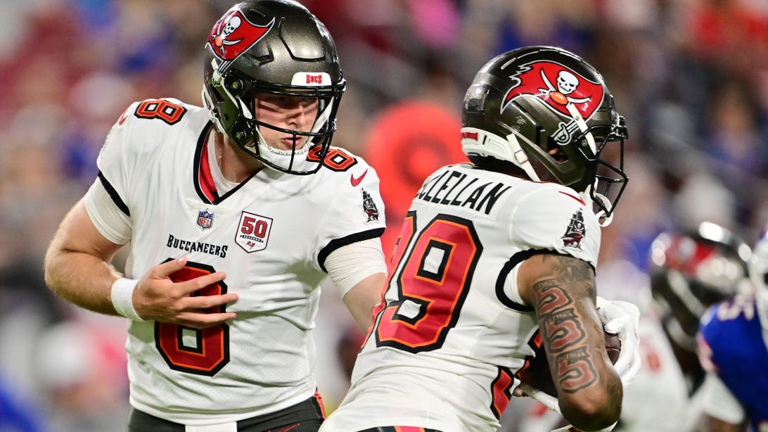 TAMPA, FLORIDA - AUGUST 23: Connor Bazelak #8 of the Tampa Bay Buccaneers hands the ball off to Jase McClellan #39 in the second half during the NFL Preseason 2025 game between Buffalo Bills and Tampa Bay Buccaneers at Raymond James Stadium on August 23, 2025 in Tampa, Florida.
