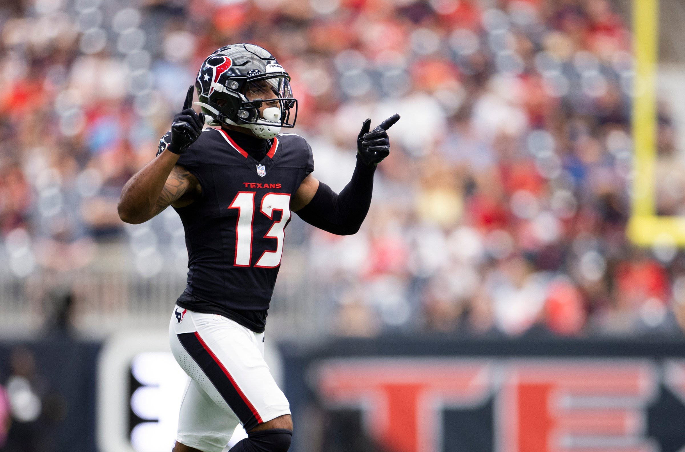 HOUSTON, TEXAS - AUGUST 16: Christian Kirk #13 of the Houston Texans runs onto the field during the NFL Preseason 2025 game between Carolina Panthers and Houston Texans at NRG Stadium on August 16, 2025 in Houston, Texas. (Photo by Kara Durrette/Getty Images)