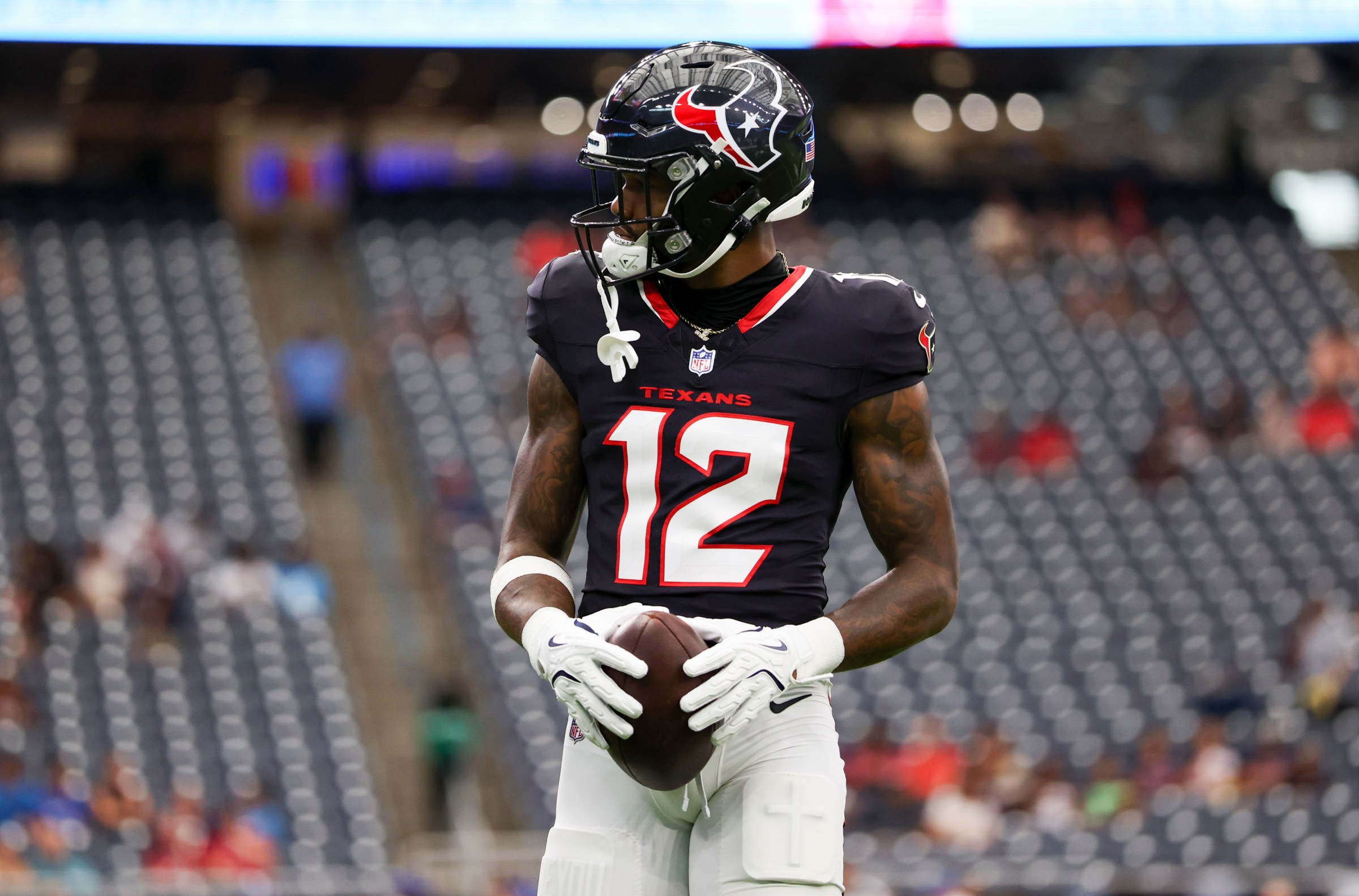 HOUSTON, TEXAS - AUGUST 16: Nico Collins #12 of the Houston Texans warms up prior to the NFL Preseason 2025 game between Carolina Panthers and Houston Texans at NRG Stadium on August 16, 2025 in Houston, Texas. (Photo by Kara Durrette/Getty Images)