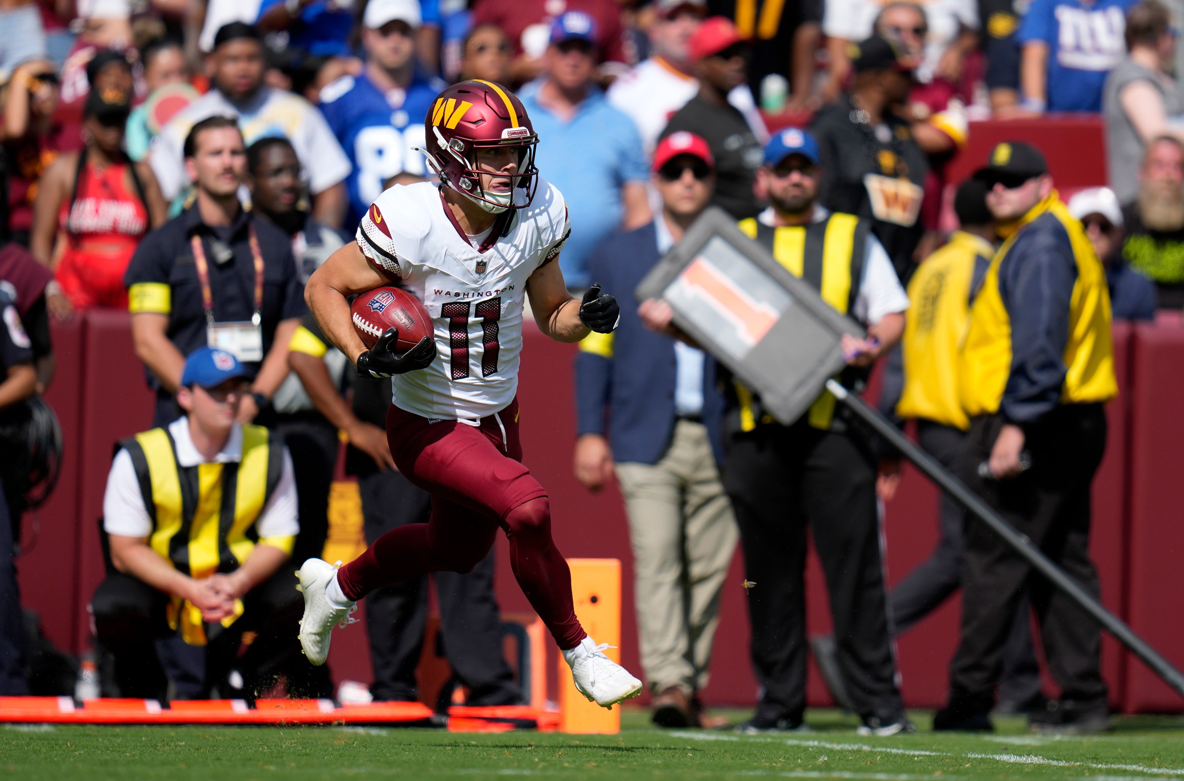 LANDOVER, MARYLAND - SEPTEMBER 07: Luke McCaffrey #11 of the Washington Commanders runs with the ball during the game against the New York Giants at Northwest Stadium on September 07, 2025 in Landover, Maryland. (Photo by Jess Rapfogel/Getty Images)