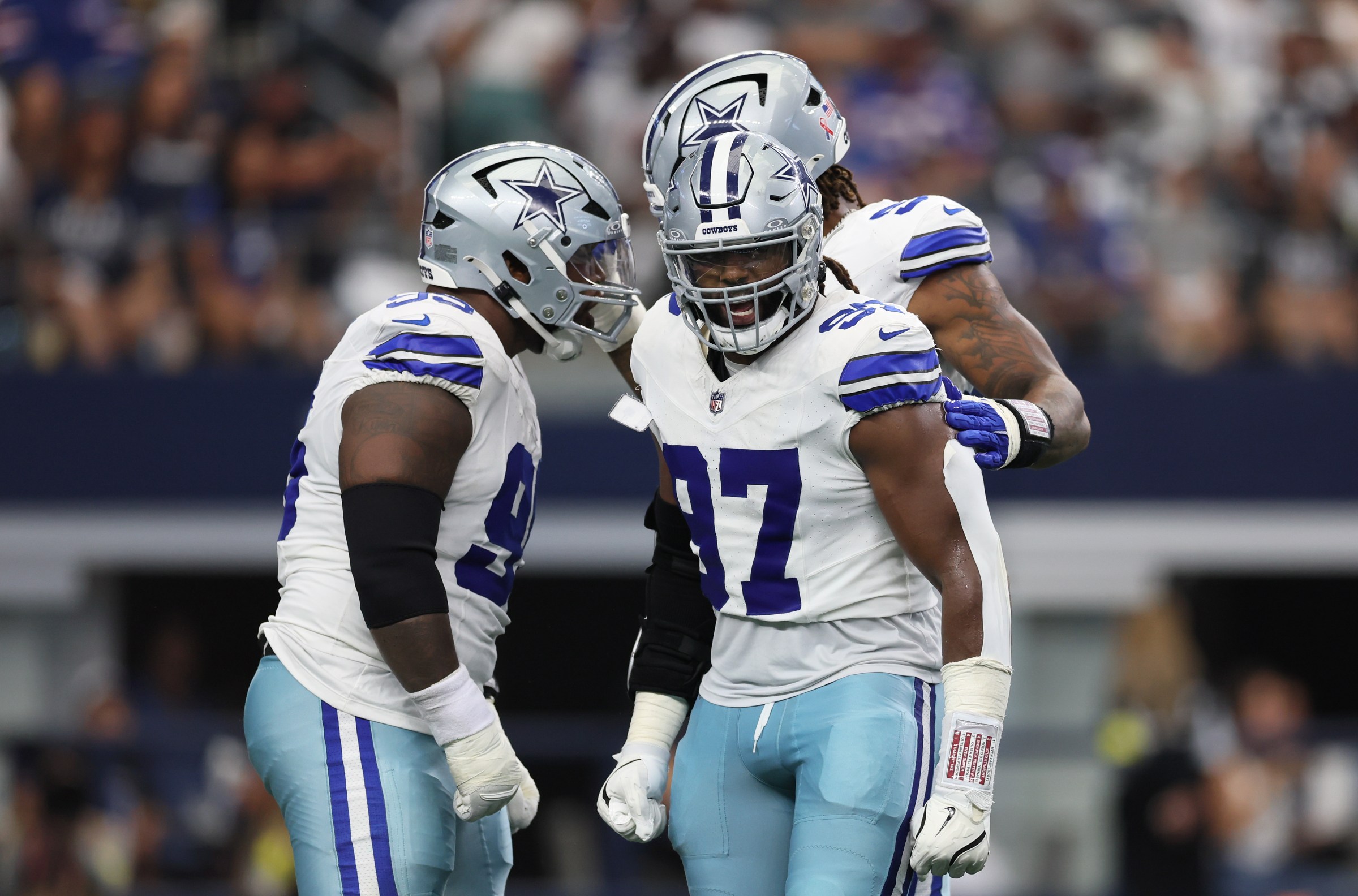 ARLINGTON, TEXAS - SEPTEMBER 14: Osa Odighizuwa #97 of the Dallas Cowboys reacts after a sack during the first half of the NFL 2025 game N at AT&T Stadium on September 14, 2025 in Arlington, Texas. (Photo by Sam Hodde/Getty Images)