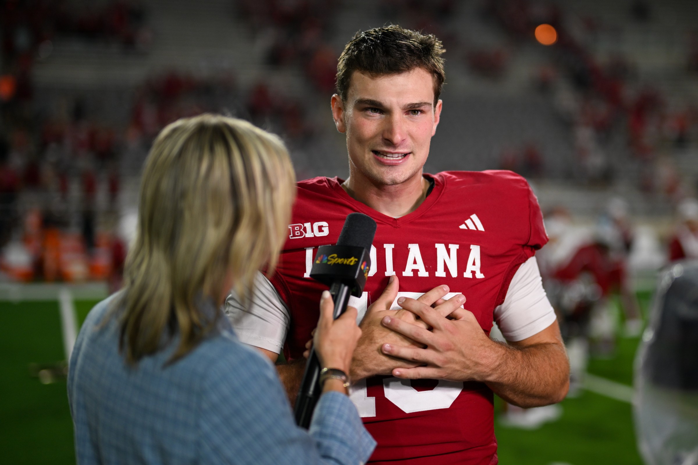 BLOOMINGTON, IN - SEPTEMBER 20: Indiana Hoosiers QB Fernando Mendoza (15) speaks with NBC Sports sideline reporter Kathryn Tappen following a college football game between the Illinois Fighting Illini and Indiana Hoosiersi on September 20, 2025 at Memorial Stadium in Bloomington, IN (Photo by James Black/Icon Sportswire via Getty Images)