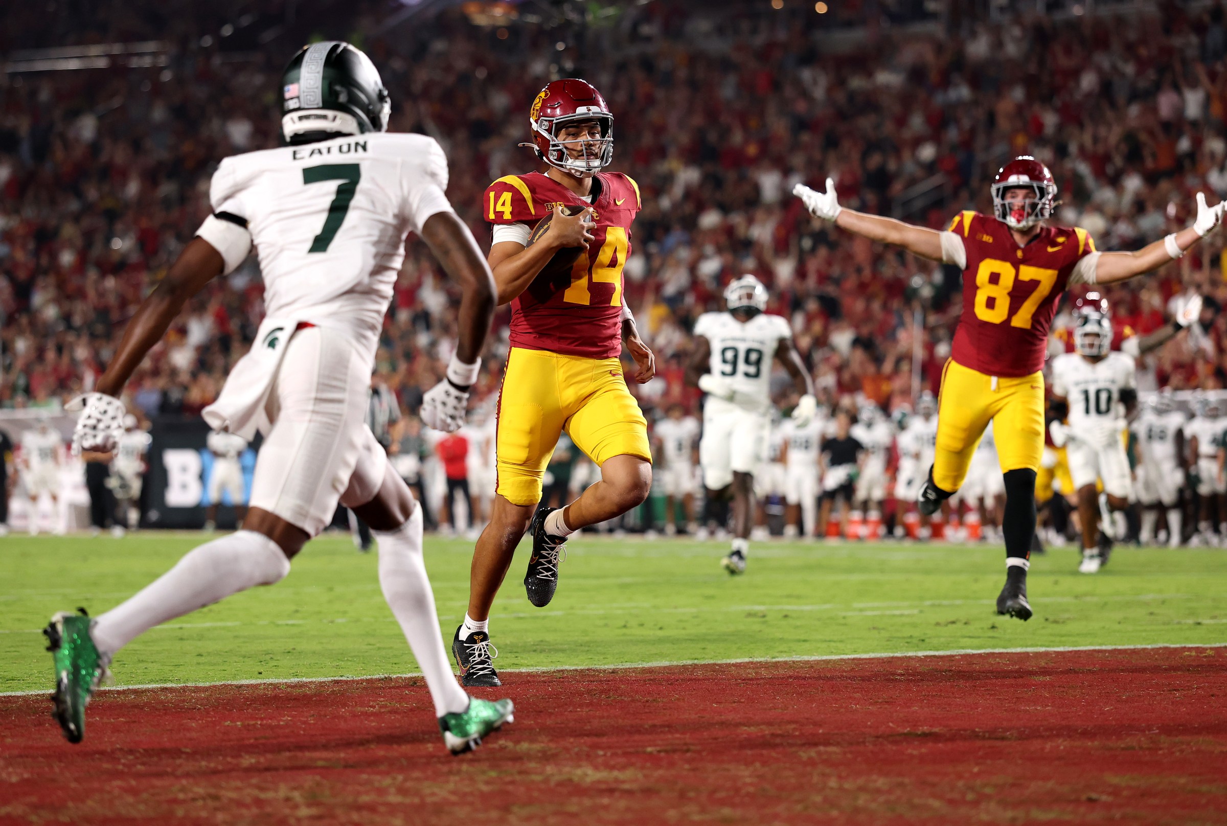 LOS ANGELES, CALIFORNIA - SEPTEMBER 20: Jayden Maiava #14 of the USC Trojans runs the ball in for a touchdown against the Michigan State Spartans during the first quarter at Los Angeles Memorial Coliseum on September 20, 2025 in Los Angeles, California. (Photo by Luke Hales/Getty Images)