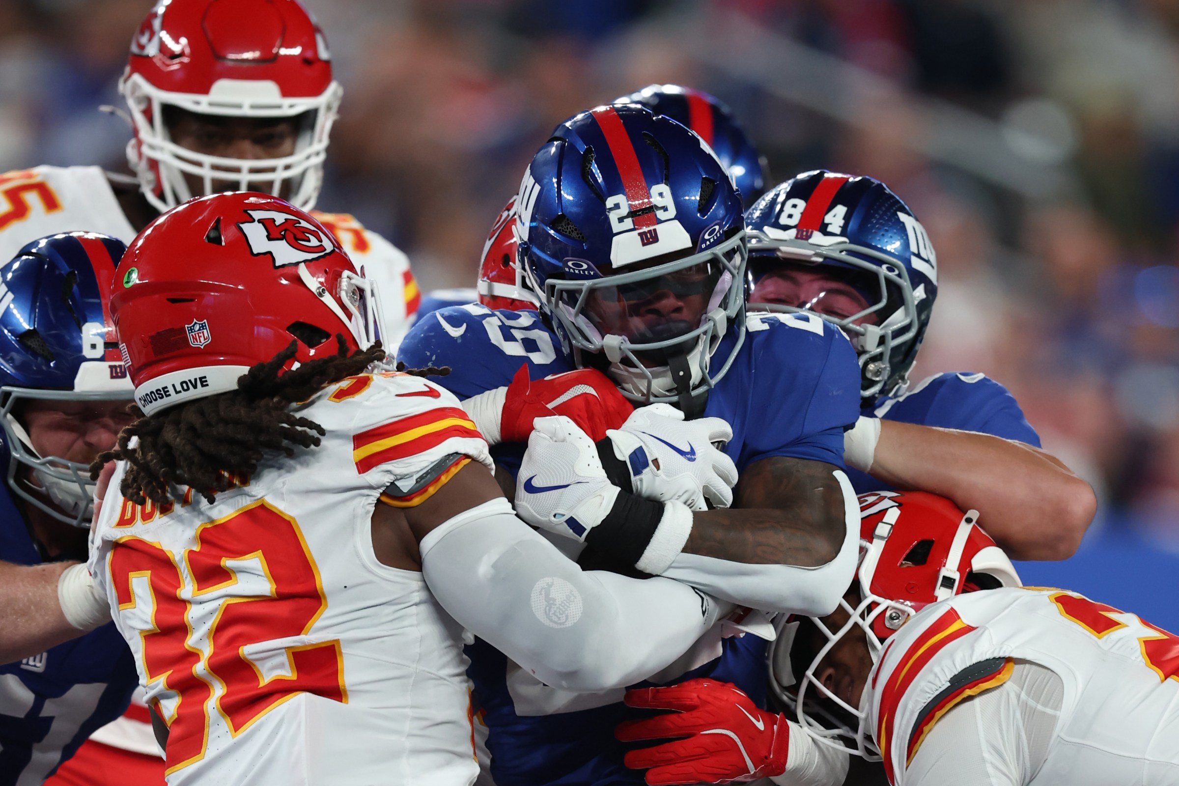 EAST RUTHERFORD, NEW JERSEY - SEPTEMBER 21: Tyrone Tracy Jr. #29 of the New York Giants rushes against Nick Bolton #32 of the Kansas City Chiefs during the first quarter at MetLife Stadium on September 21, 2025 in East Rutherford, New Jersey. (Photo by Elsa/Getty Images)