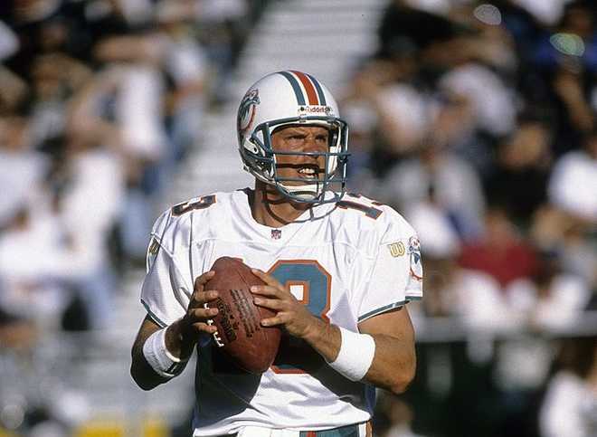 OAKLAND, CA - DECEMBER 1, 1996:  Quarterback Dan Marino #13 of the Miami Dolphins sets up to throw a pass against the Oakland Raiders during an NFL football game December 1, 1996 at the Oakland Coliseum in Oakland, California. Marino played for the Dolphins from 1983-99. (Photo by Focus on Sport/Getty Images)