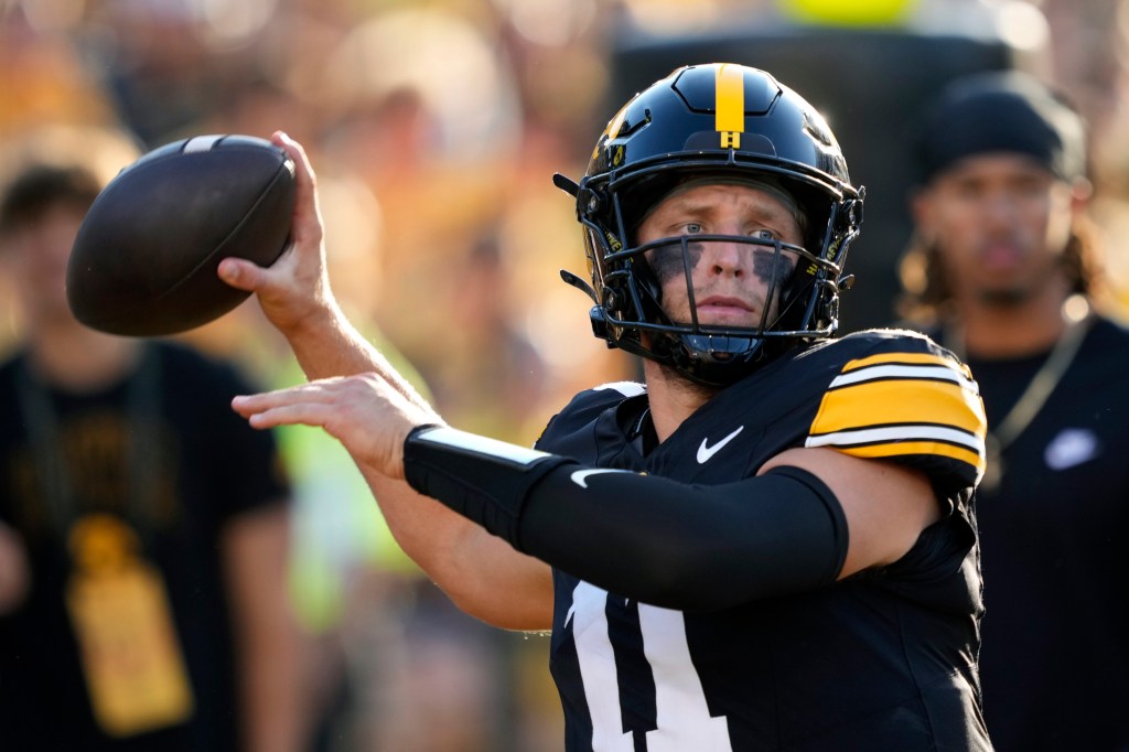 Iowa quarterback Mark Gronowski warms up before an NCAA college football game against Massachusetts.