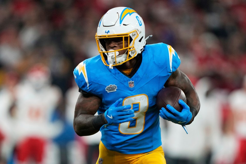 Los Angeles Chargers running back Omarion Hampton carrying the football.