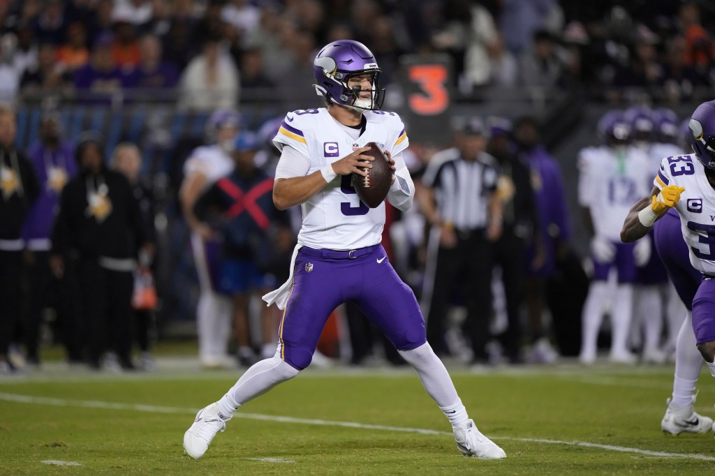 Minnesota Vikings quarterback J.J. McCarthy drops back to pass during the first half of an NFL football game against the Chicago Bears Monday, September 8, 2025, in Chicago. 