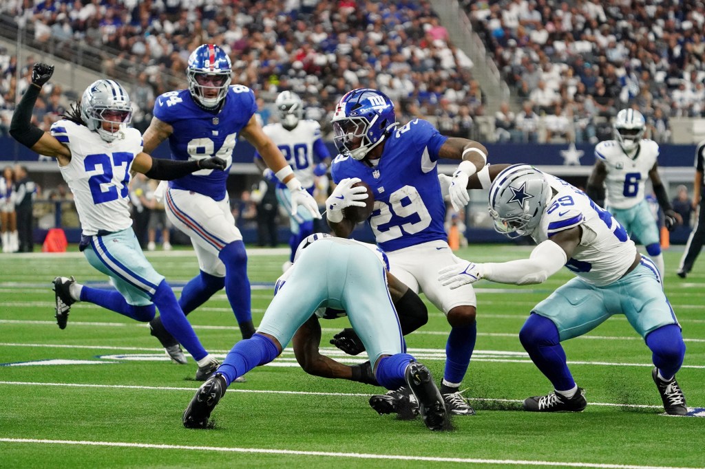 Tyrone Tracy Jr. runs with the ball during the Giants-Cowboys game on Sept. 14, 2025. 