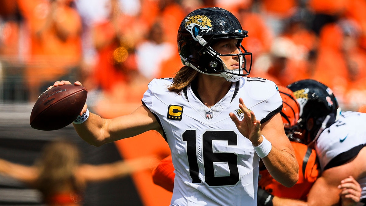 Trevor Lawrence looks to throw
