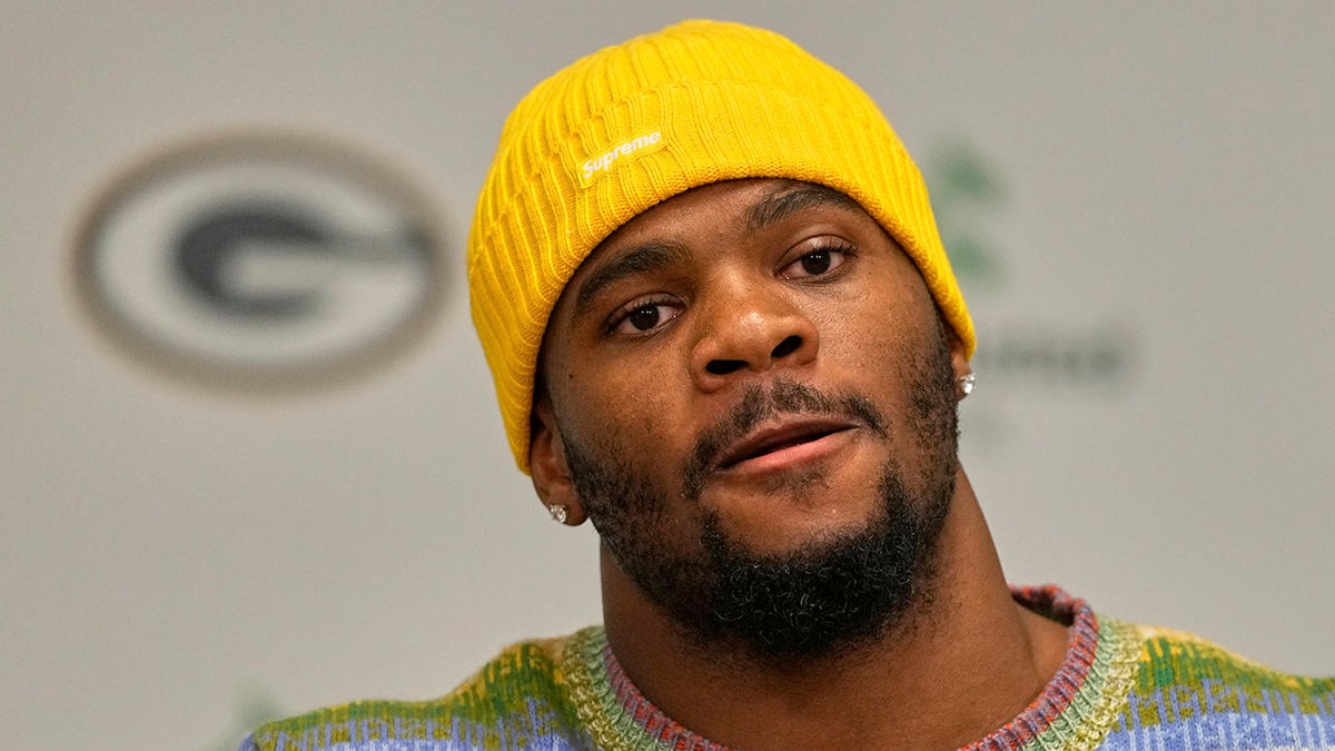 Micah Parsons talks to reporters