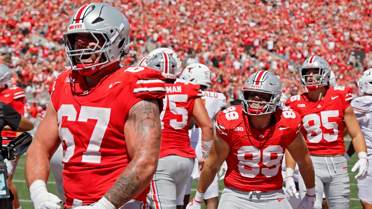 Ohio State offensive lineman Austin Siereveld, left, and tight end Will Kacmarek celebrate their touchdown against Texas during the first half of an NCAA college football game, Saturday, Aug. 30, 2025, in Columbus, Ohio.