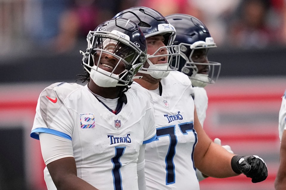 Tennessee Titans quarterback Cam Ward walks to the sideline after throwing an interception.