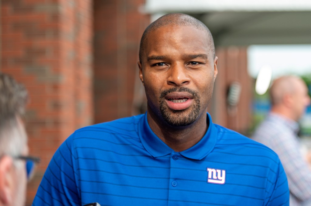 Retired New York Giants player Osi Umenyiora speaking at training camp.