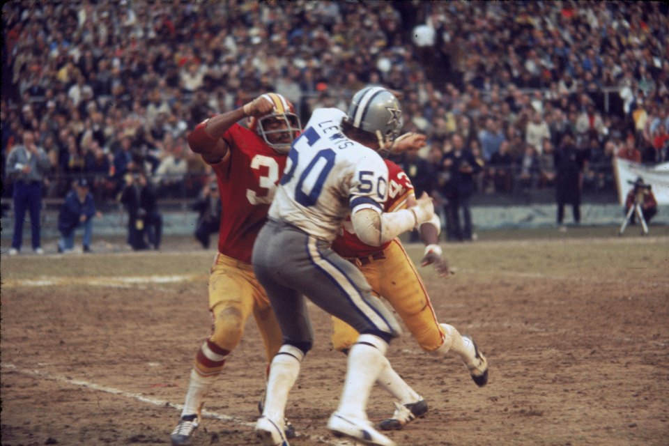 Running back Charlie Harraway #31 of the Washington Redskins blocking linebacker D.D. Lewis #50 of the Dallas Cowboys during the 1972 NFC Championship Game.