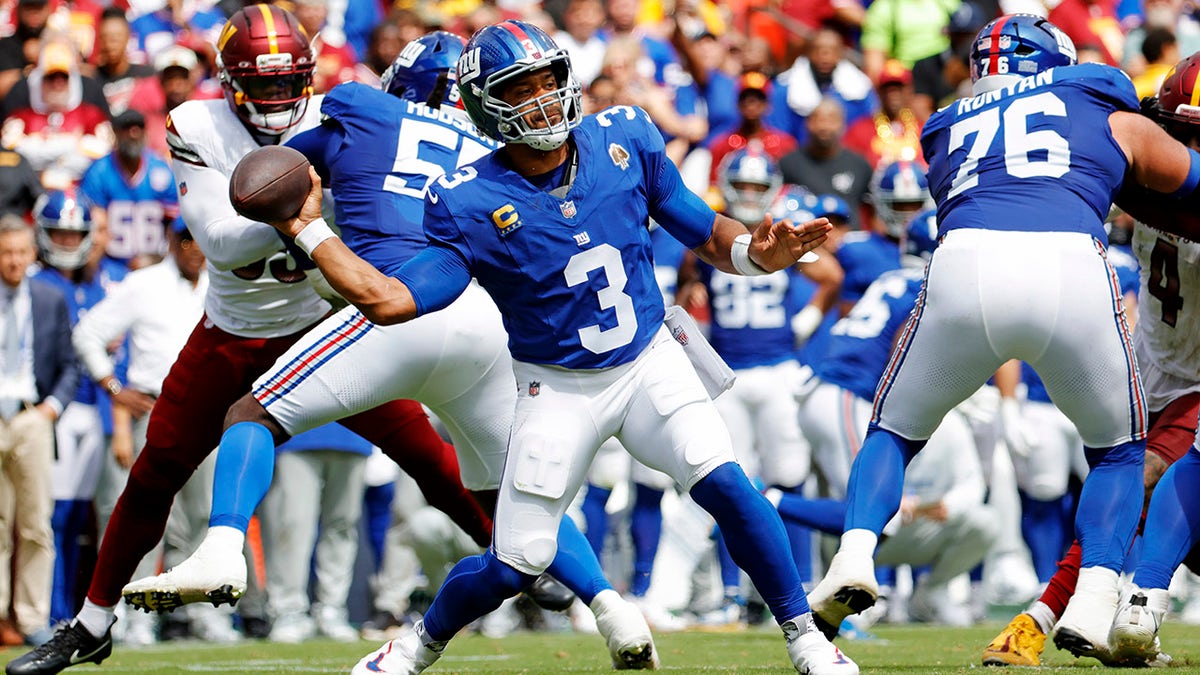 Russell Wilson passes