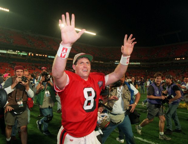 San Francisco 49ers quarterback Steve Young runs a victory lap after his team beat the San Diego Chargers 49-26 on Jan. 29, 1995 in Super Bowl XXIX at Miami's Joe Robbie Stadium. (AP Photo/Lenny Ignelzi)