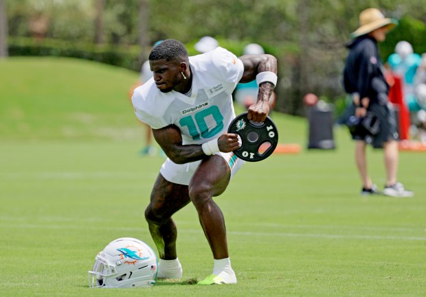 Miami Dolphins Tyreek Hill warms up during practice on Wednesday,...