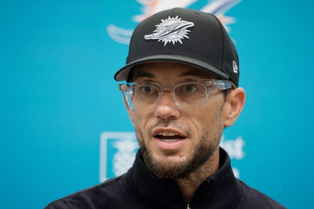 Miami Dolphins coach Mike McDaniel talks to the media before...