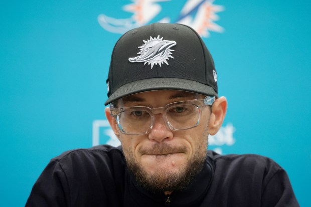 Miami Dolphins coach Mike McDaniel talks to the media before...