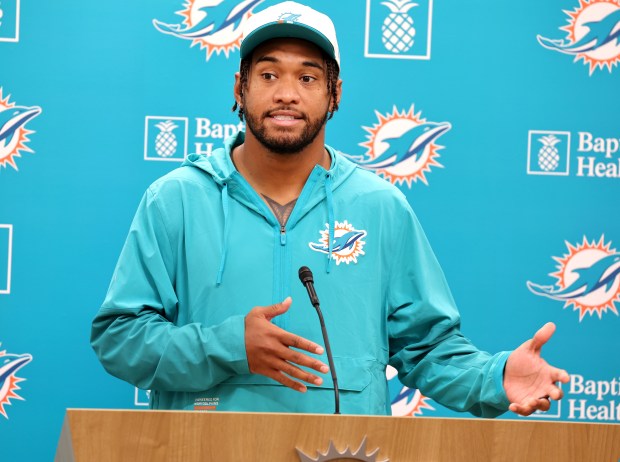 Miami Dolphins quarterback Tua Tagovailoa speaks after practice at the...