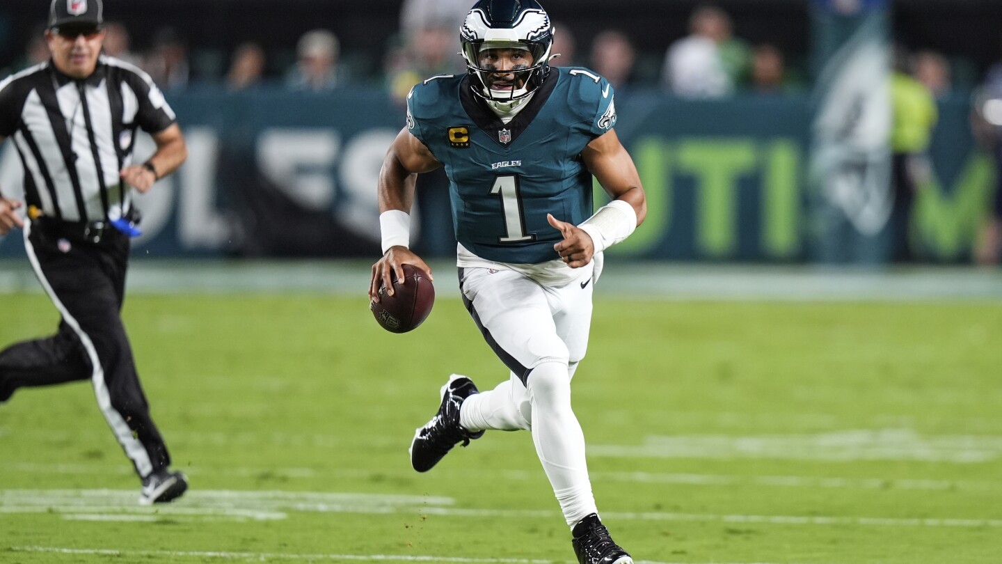 Defending champion Eagles edge Cowboys 24-20 in wild, lightning-delayed NFL season opener