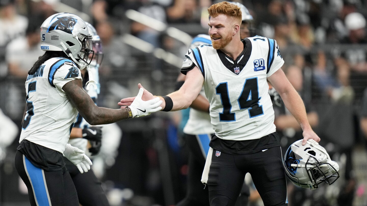 Andy Dalton passes for 319 yards and 3 TDs to lead Panthers past Raiders 36-22 for first win