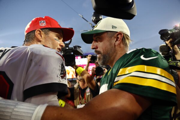 Tampa Bay Buccaneers quarterback Tom Brady (12) and Green Bay Packers quarterback Aaron Rodgers (12) greet after the game at Raymond James Stadium.