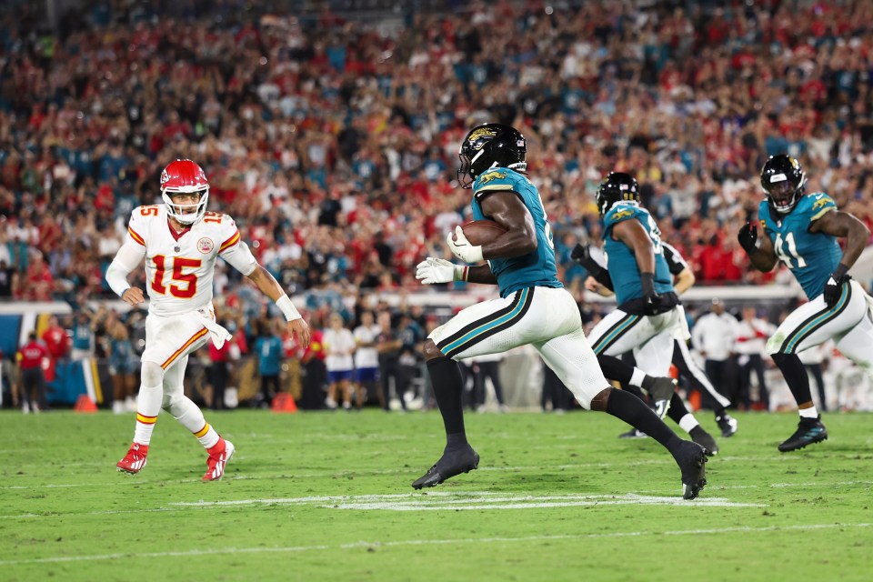 Devin Lloyd of the Jacksonville Jaguars intercepts a ball.
