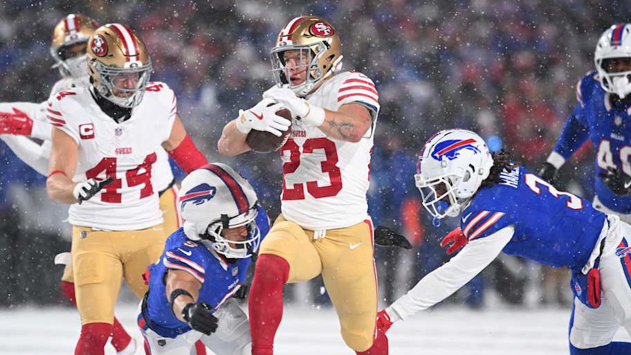 San Francisco 49ers running back Christian McCaffrey is tackled by Buffalo Bills safeties Taylor Rapp and Damar Hamlin