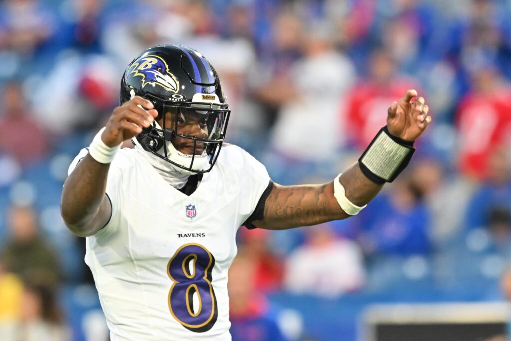 Baltimore Ravens quarterback Lamar Jackson warms up prior to the game against the Buffalo Bills at Highmark Stadium.