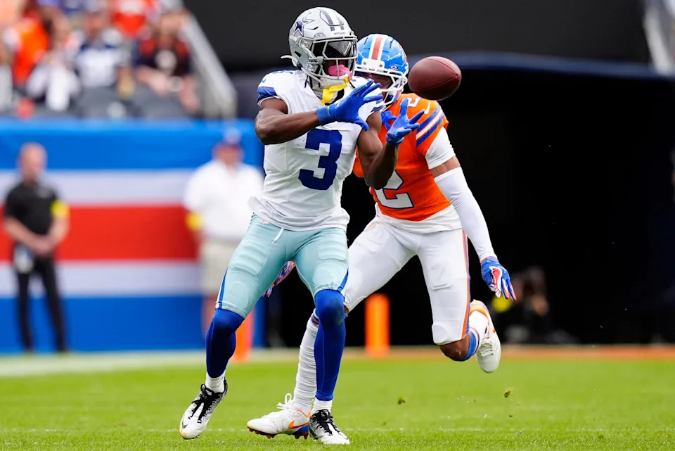 Dallas Cowboys wide receiver George Pickens makes a catch against Denver Broncos cornerback Pat Surtain II.